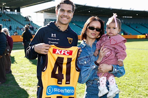 Debutant, Matt Hill of the Hawks poses with family.