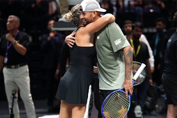 Nick Kyrgios and Aryna Sabalenka embrace at the end of the match.