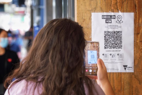 A person scans a QR code in the city in early January.
