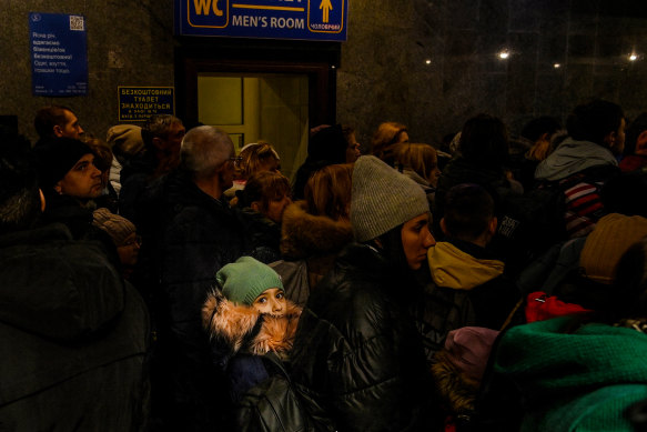 Crowds inside Lviv railway station queue to catch the train to Poland.