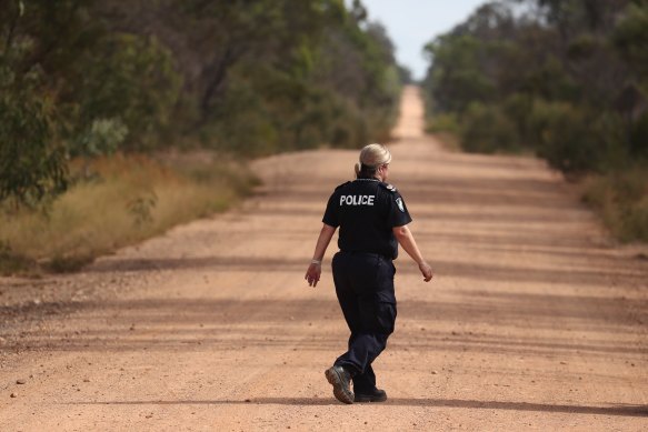 Police work near the scene of a fatal shooting in Wieambilla, Queensland, Tuesday, December 13, 2022. 