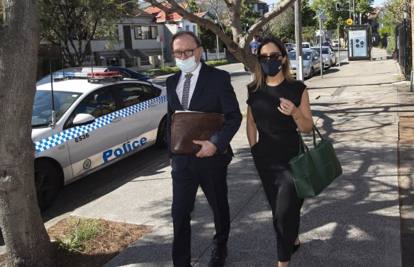 Eyebrow queen Kristin Fisher arrives at Waverley Local Court on Wednesday with her lawyer Michael Bowe.