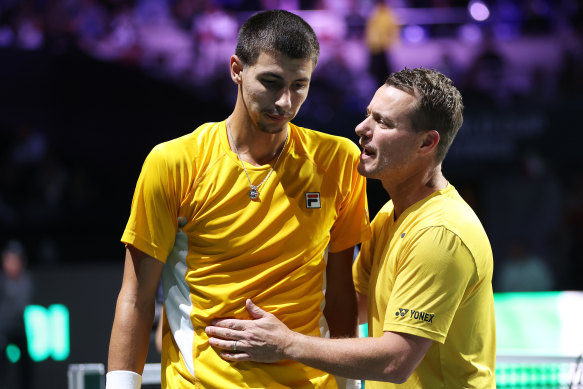Alexei Popyrin is consoled by Lleyton Hewitt after his defeat.