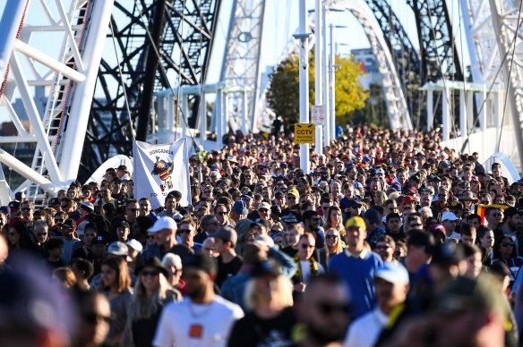 Fans make their over the Matagarup Bridge to Optus Stadium during the Dreamtime match earlier this year.