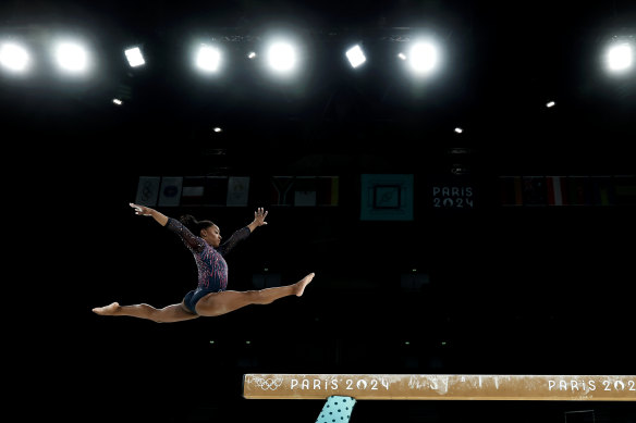 Simone Biles of the US practices on the balance beam during a training session in Paris.