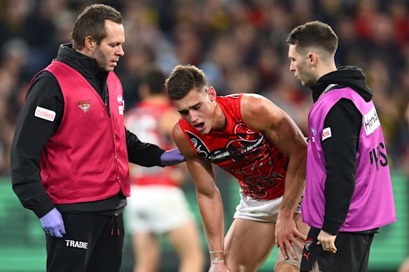 Archer May (centre) was taken to hospital on a brutal night on the injury front for Brad Scott's beleaguered bombers.