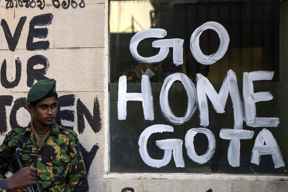 Sri Lankan soldiers patrol near the official residence of president Gotabaya Rajapaksa.