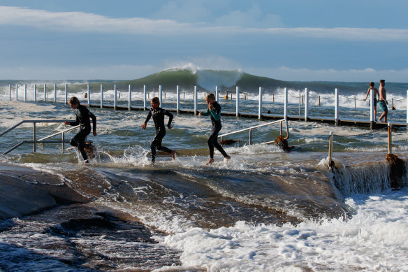 Locals play in the surf at Narrabeen.