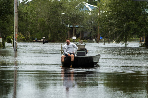 Kiln, Mississippi resident Dennis Mayfield waits to help his family and neighbours on Monday.