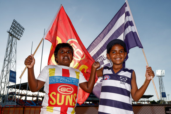 Young Gold Coast and Geelong fans prepare for the clash in Darwin.
