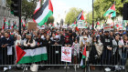 Protesters with placards and Palestinian flags attend a Stop The War Coalition demonstration in London on Saturday.