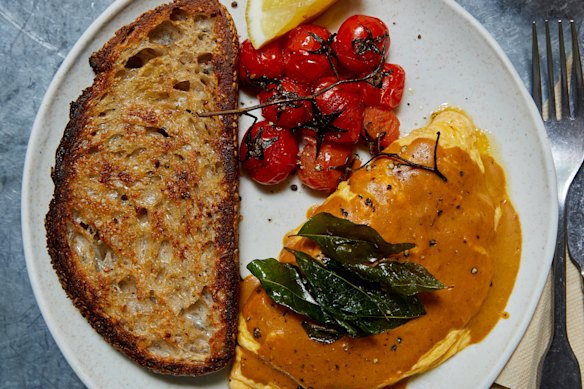 Curry omelette and roasted tomatoes .