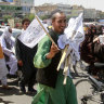 A man sells Taliban flags in Herat province, west of Kabul, Afghanistan, on Saturday, August 14.