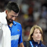 Novak Djokovic leaves centre court for a medical timeout.