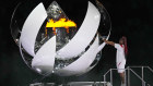 Naomi Osaka lights the Olympic flame during the opening ceremony.