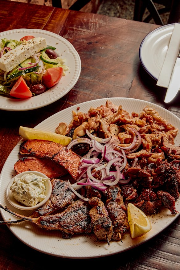 Grilled meat platter and salad.
