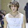 Delicate cottons and bold earrings on the Prada runway in Milan.