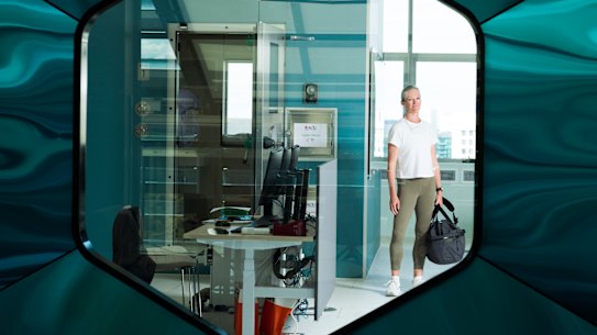 Journalist Sarah Berry outside the metabolic chamber at the Australian Catholic University, Melbourne. Being inside it is like being on a plane to nowhere, she says, “yet I’m aware it could transport some people towards a new and healthier life.”