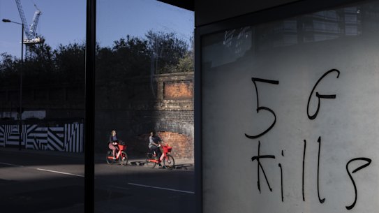 One of the more popular conspiracy theories has it that 5G mobile towers cause COVID-19. Here the theory on a bus stop in Shoreditch in London.