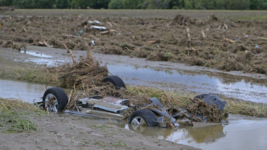 A car is washed into a ditch in Napier, New Zealand.