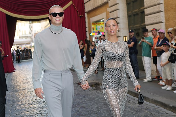 Erling Haaland and Isabel Haugseng Johansen outside the Dolce & Gabbana Alta Sartoria fashion show at Castel Sant'Angelo on July 15, 2025 in Rome, Italy.