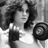 Lisa Lyon with weights in Paris, 1980.