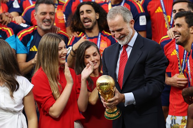 King Felipe VI of Spain holds the FIFA World Cup Winner’s Trophy while Queen Letizia of Spain, Princess Leonor of Spain and Princess Sofia of Spain and players of Spain watch at the award ceremony following the FIFA World Cup 2026 Final match at New York New Jersey Stadium on July 19, 2026 in East Rutherford, New Jersey.