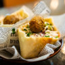 Wazzup Falafel sells its signature dish on skewers, in house-made wraps with hummus; or as a FSP (falafel snack pack).