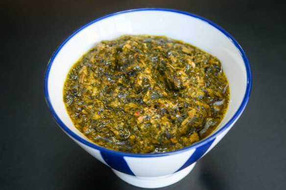 A bowl of pondu, which is made with cassava, leek and celery.