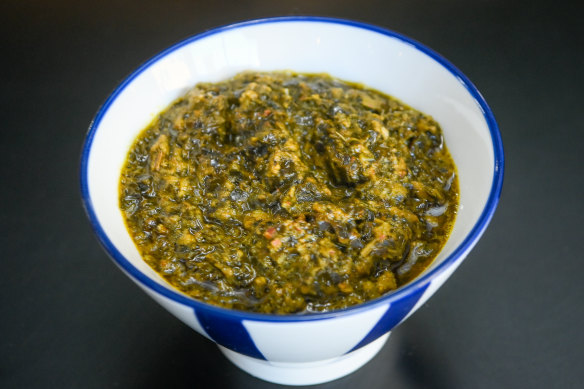 A bowl of pondu, which is made with cassava, leek and celery.