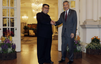 North Korean leader Kim Jong-un meets Singapore's Prime Minister Lee Hsien Loong.