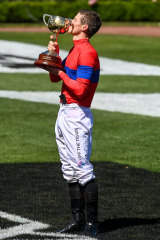 James McDonald’s moment with the Melbourne Cup trophy.
