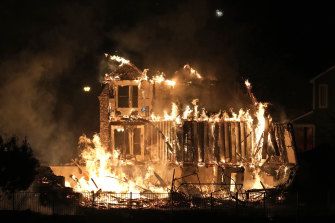 Homes burn as a wildfire rips through a development near Rock Creek Village, near Broomfield, Colorado, on Thursday night (Friday AEDT).