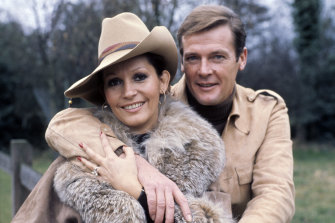 Luisa Moore and Roger Moore pose in the English countryside c1970s.