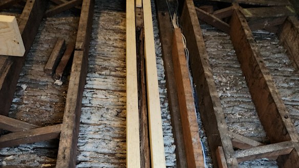 Repairs undertaken by Nathan Kulinitsch to brace a termite-damaged beam in his house in Dawes Point.