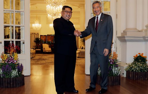 North Korean leader Kim Jong-un meets Singapore's Prime Minister Lee Hsien Loong.