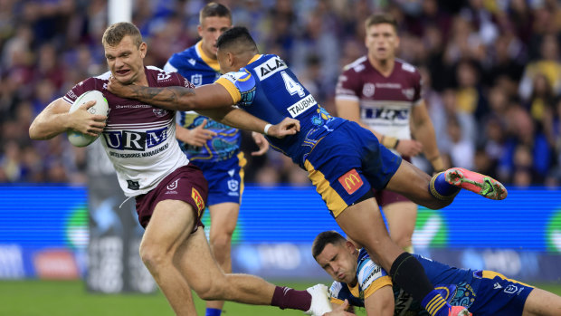 Tom Trbojevic is tackled by Waqa Blake of the Eels at Bankwest Stadium.