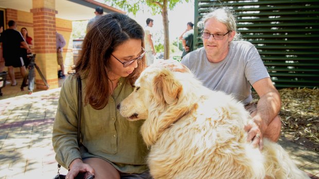 Tara and Anton Minchin with their dog Bear.