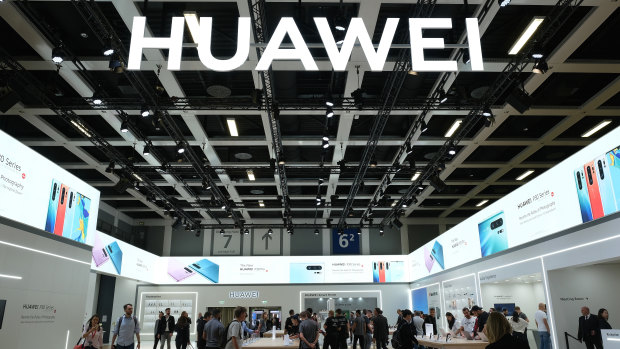 Visitors check out new Huawei smartphones in Berlin, Germany. 