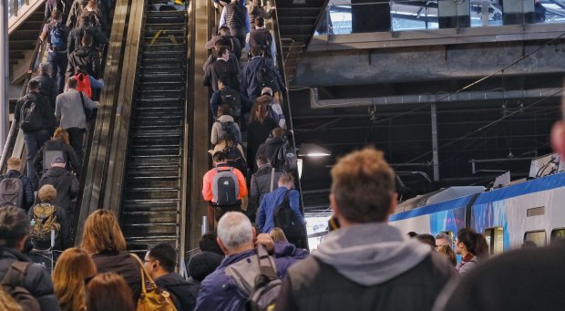 Commuters slowly making their way up the escalators at Southern Cross Station on Tuesday morning. One escalator is broken and may not be fixed for months. 