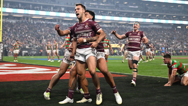 Luke Brooks and the Sea Eagles celebrate a try and victory in Las Vegas.