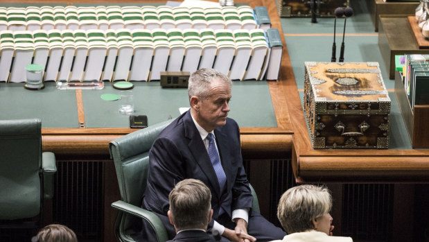 Opposition leader Bill Shorten listens as Treasurer Josh Frydenberg hands down the budget in the House of Representatives at Parliament House in Canberra on April 2, 2019.
