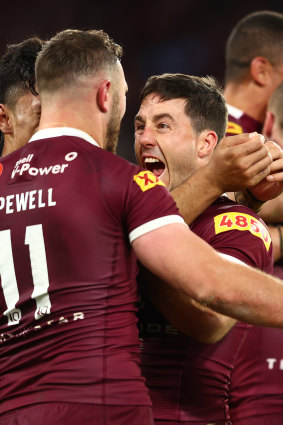 Ben Hunt is mobbed after his series-sealing try.