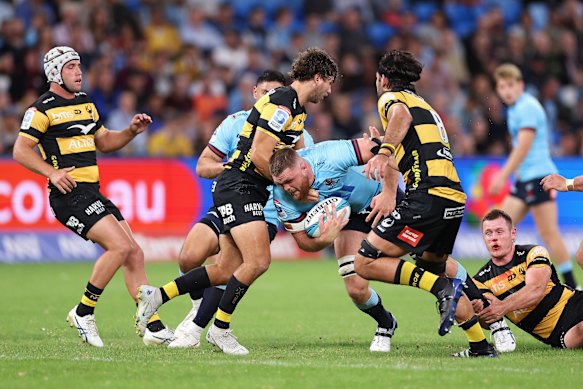 Swinton is tackled against the Force.