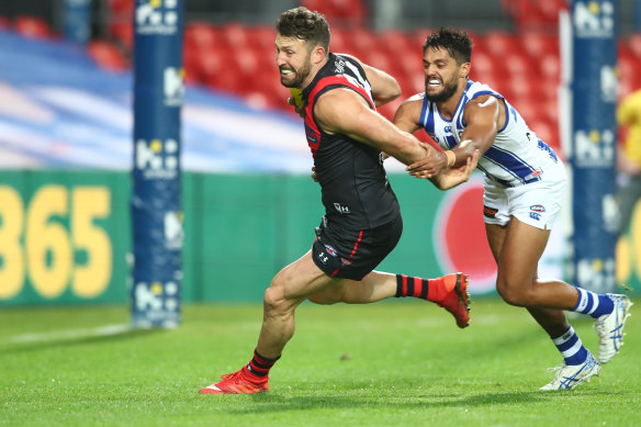 Cale Hooker, left, and Aaron Hall, right, compete in wet conditions at Metricon. 