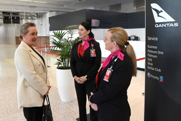 Working the crowd: New Qantas chief  Vanessa Hudson (left) meets staff at Melbourne Airport.