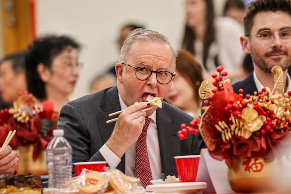 Albanese enjoys a dumpling at a Lunar New Year celebration at the Lower Templestowe Community Centre in Melbourne. 