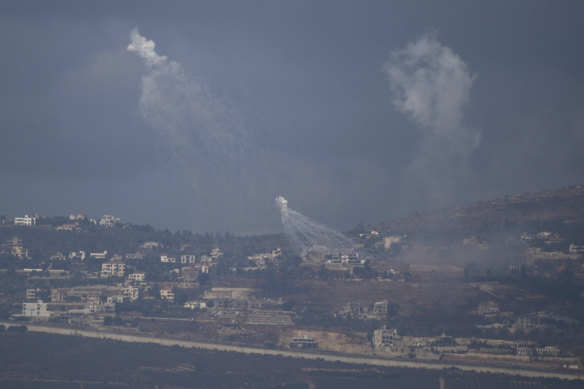 Israeli shelling hits an area in southern Lebanon as seen from northern Israel, on Tuesday.