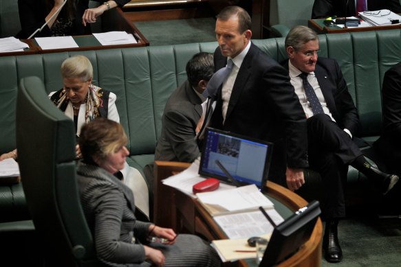 Then-opposition leader Tony Abbott leaves the House after being ejected for an hour by deputy Speaker Anna Burke (left) during question time in 2012. 