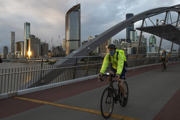 A cyclist travels along Southbank in Brisbane. 